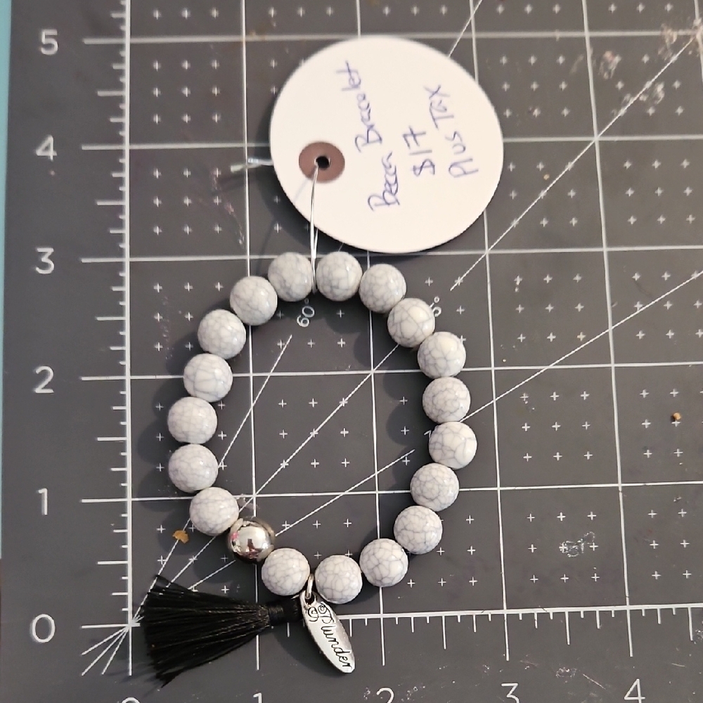 Plunder White Beaded Bracelet with Black Tassel